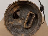 a metal object that is sitting on a cardboard box