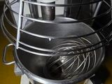 an image of a kitchen with a large bowl and a whisk