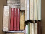 a box full of books that are sitting on the floor