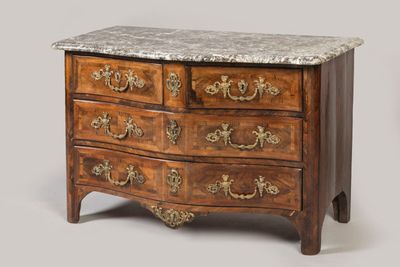 a marble top chest of drawers with a marble top
