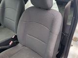 two seats in the back of a car that is dirty