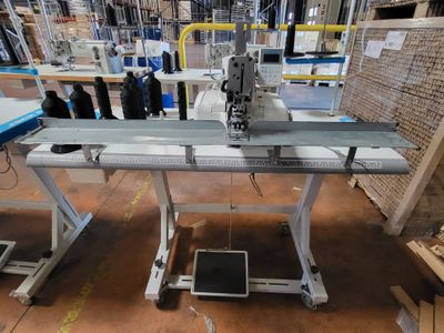 a machine that is sitting on a table in a warehouse