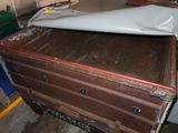 a large piece of luggage sitting on top of a cart