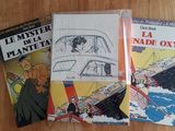 trois livres posés sur une table