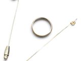 a ring, a pin, and a pair of pins on a white surface