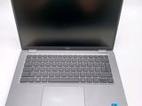 an open laptop computer sitting on top of a white table
