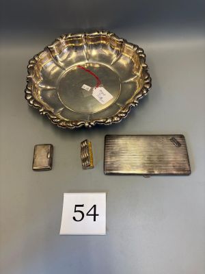 a silver plate with a number on it next to a lighter