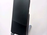 a cell phone that is sitting on top of a stand