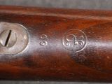 a close up of a baseball bat with a number on it