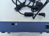 an image of a blue box with wires and a remote control