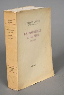 a book sitting on top of a table next to a gray table