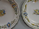 two plates that are sitting side by side on a table