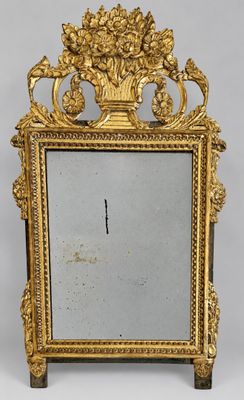 an ornately decorated mirror with a gold frame on a white background