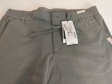 a pair of grey shorts with a tag on the side