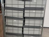 a metal rack with several bins on top of it