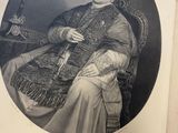 an old black and white photo of a man sitting in a chair