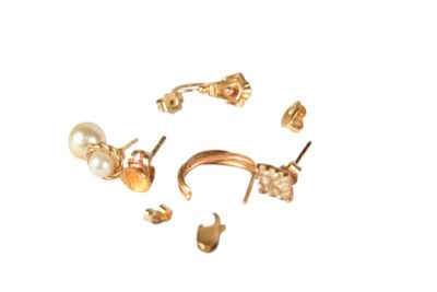 a picture of a group of gold and pearl earrings