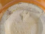 a close up of a vase with a label on it