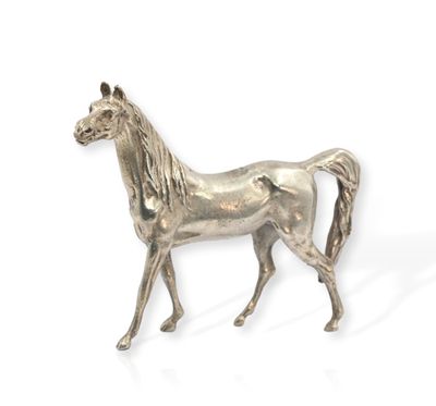 a silver statue of a horse on a white background