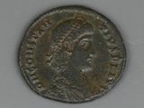 a close up of a coin with a woman on it