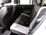 a seat in the back of a car with a seat belt