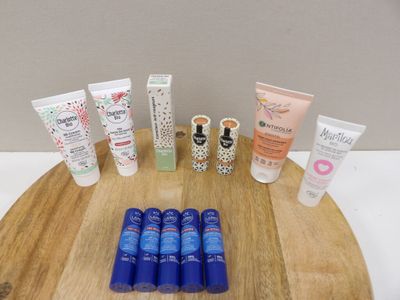 many different types of skin care products displayed on a table