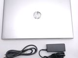 a laptop computer with a power cord attached to it