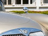 an image of a classic car parked in front of a building