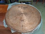 a large metal plate sitting on top of a table