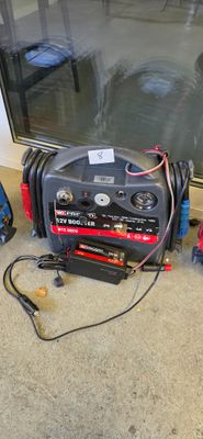 an image of a group of tools sitting on the floor next to a window