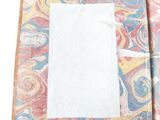 a piece of paper on top of a piece of fabric
