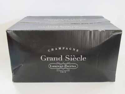 an image of a box of champagne sitting on top of a table