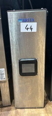 a stainless steel refrigerator next to a metal trash can on the floor