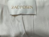 a close up of a white shirt with a label on it