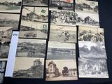 many old photographs of people and buildings on the table