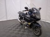 a motorcycle that is parked in a room with a checkered floor