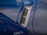 a close up of a car ' s emblem on the side of the car