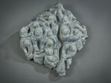 a stone sculpture of a group of people on a wall