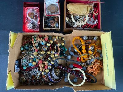 a box full of assorted jewelry sitting on a table