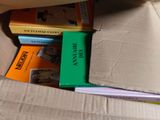 a box full of books that are sitting on the floor