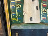 a picture of a painting of a lighthouse in a frame