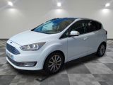 a white ford c - max parked on a checkered floor