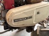 a close up of a motorcycle with a small engine