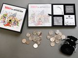 a box of coins and a bag of coins on a table