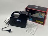 an image of a black portable air compressor sitting on top of a white table