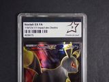 a close up of a pokemon card on a black surface