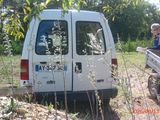 a white van that is parked in the grass