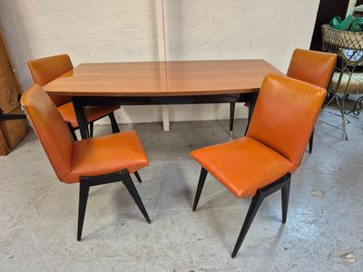 a table with four chairs and a table with four chairs