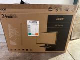 a box with a computer monitor on it sitting on the ground