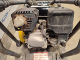 a close up of a small engine on a cart